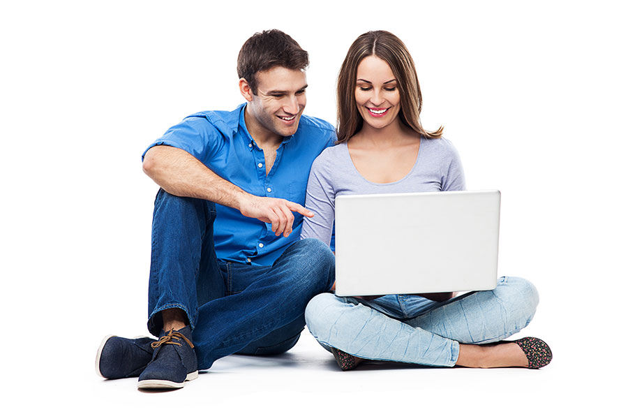 Happy Couple Requesting Appointment Online on Computer
